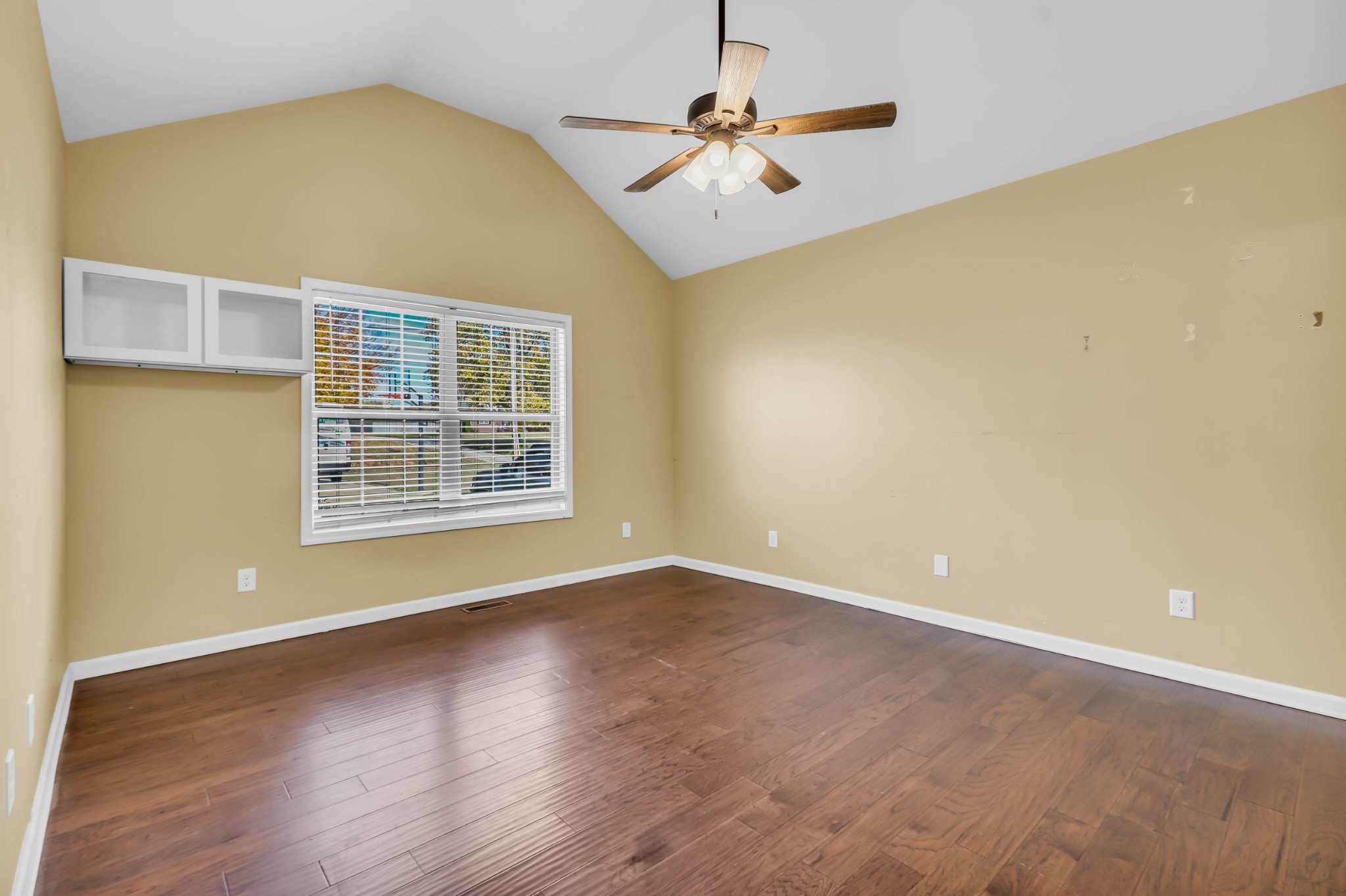 150 B T G T Road Portland, TN 37148 - Photo 18 of 20 an empty room with wooden floor and windows