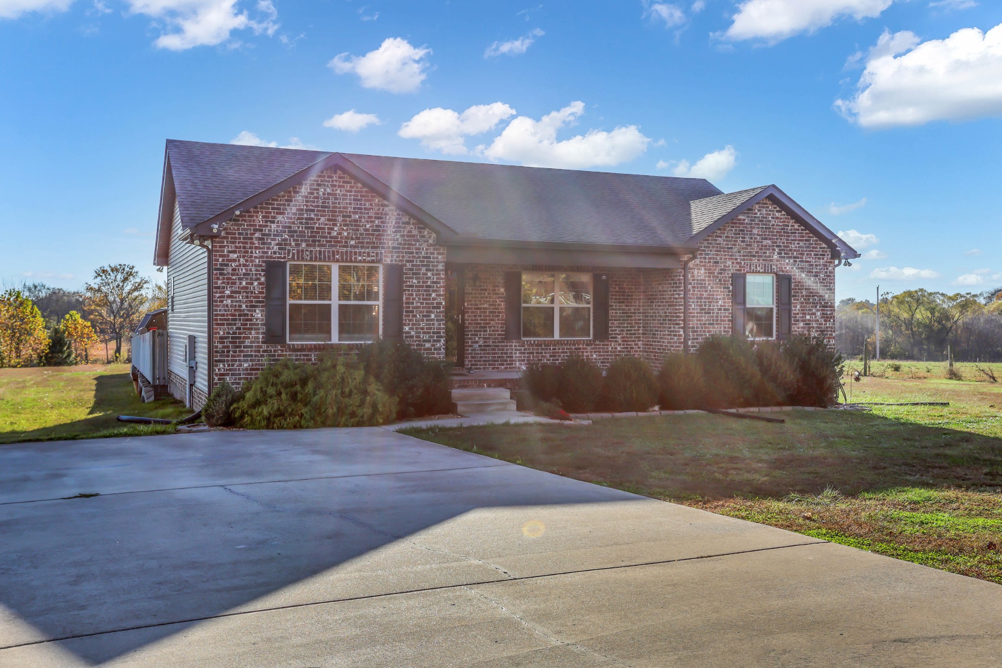 150 B T G T Road Portland, TN 37148 - Photo 3 of 20 a front view of a house with a yard and garage