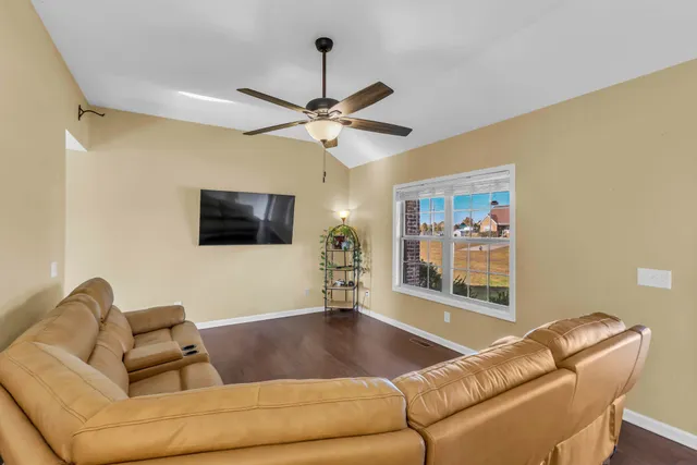 a dining room with furniture and a window