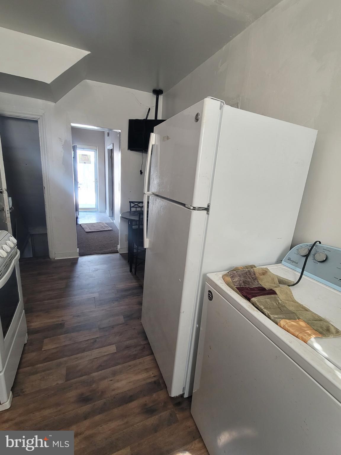 2523 Boarman Avenue Baltimore, MD 21215 - Photo 11 of 31 a utility room with wooden floor washer and dryer