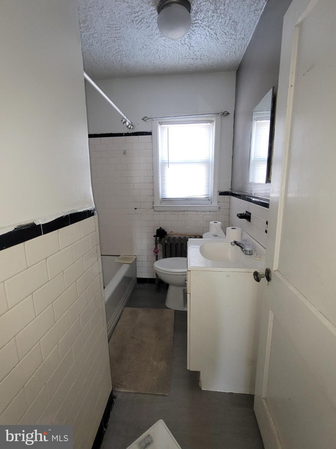 2523 Boarman Avenue Baltimore, MD 21215 - Photo 17 of 31 a bathroom with a sink toilet and shower
