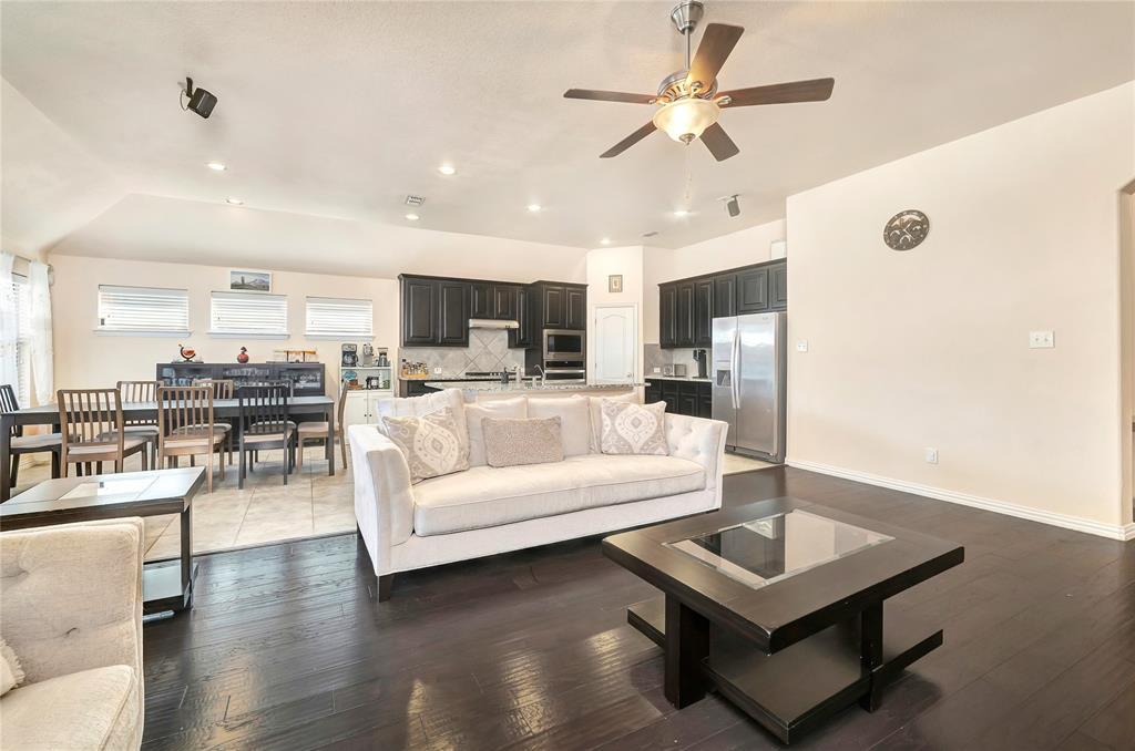 1008 Hoxton Road Forney, TX 75126 - Photo 5 of 39 a living room with furniture kitchen view and a chandelier