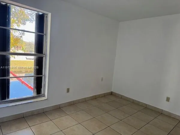 a kitchen with a refrigerator stove and cabinets