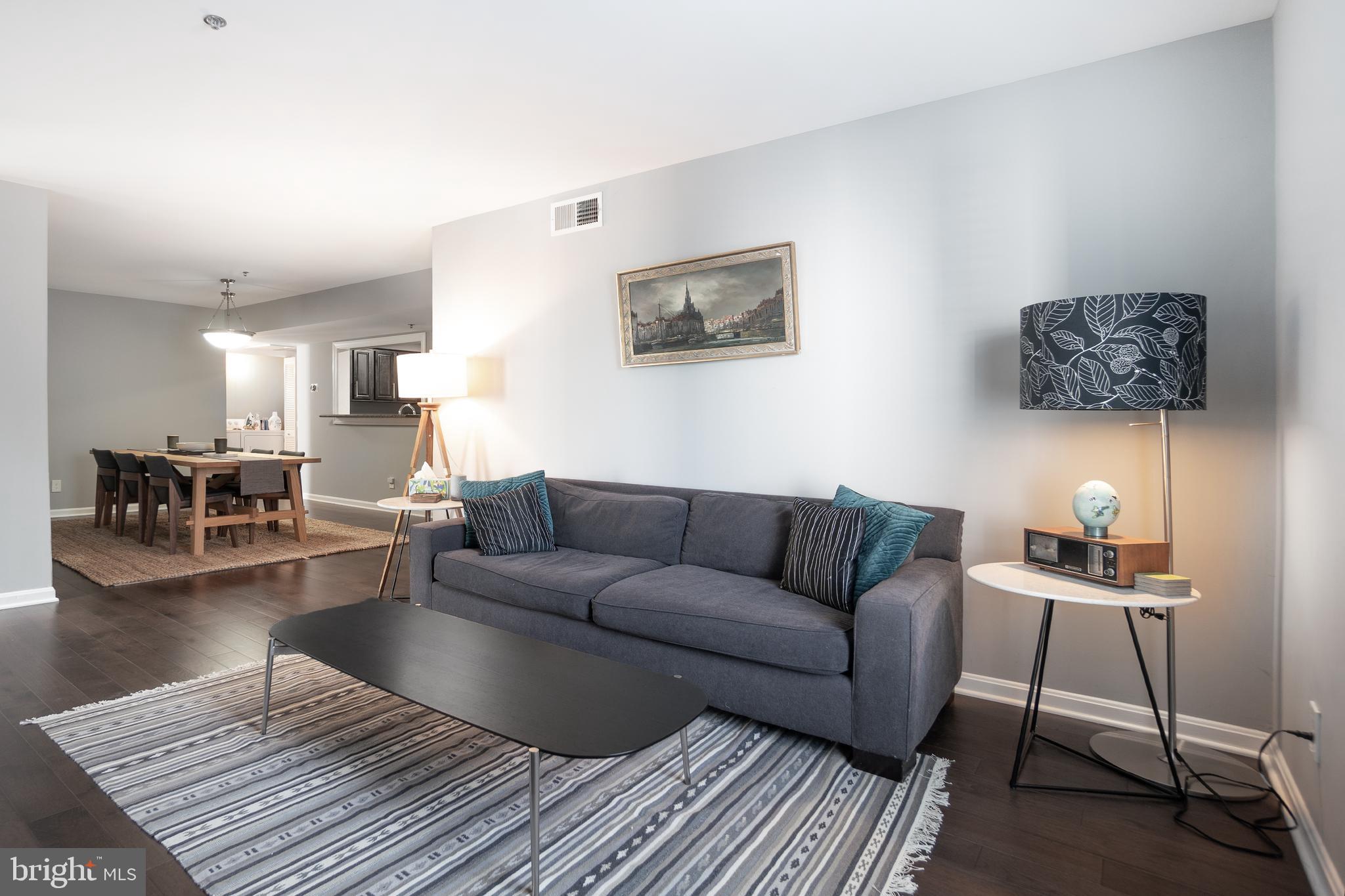10248 Appalachian Circle, Unit 1D7 Oakton, VA 22124 - Photo 13 of 32 a living room with furniture and a wooden floor