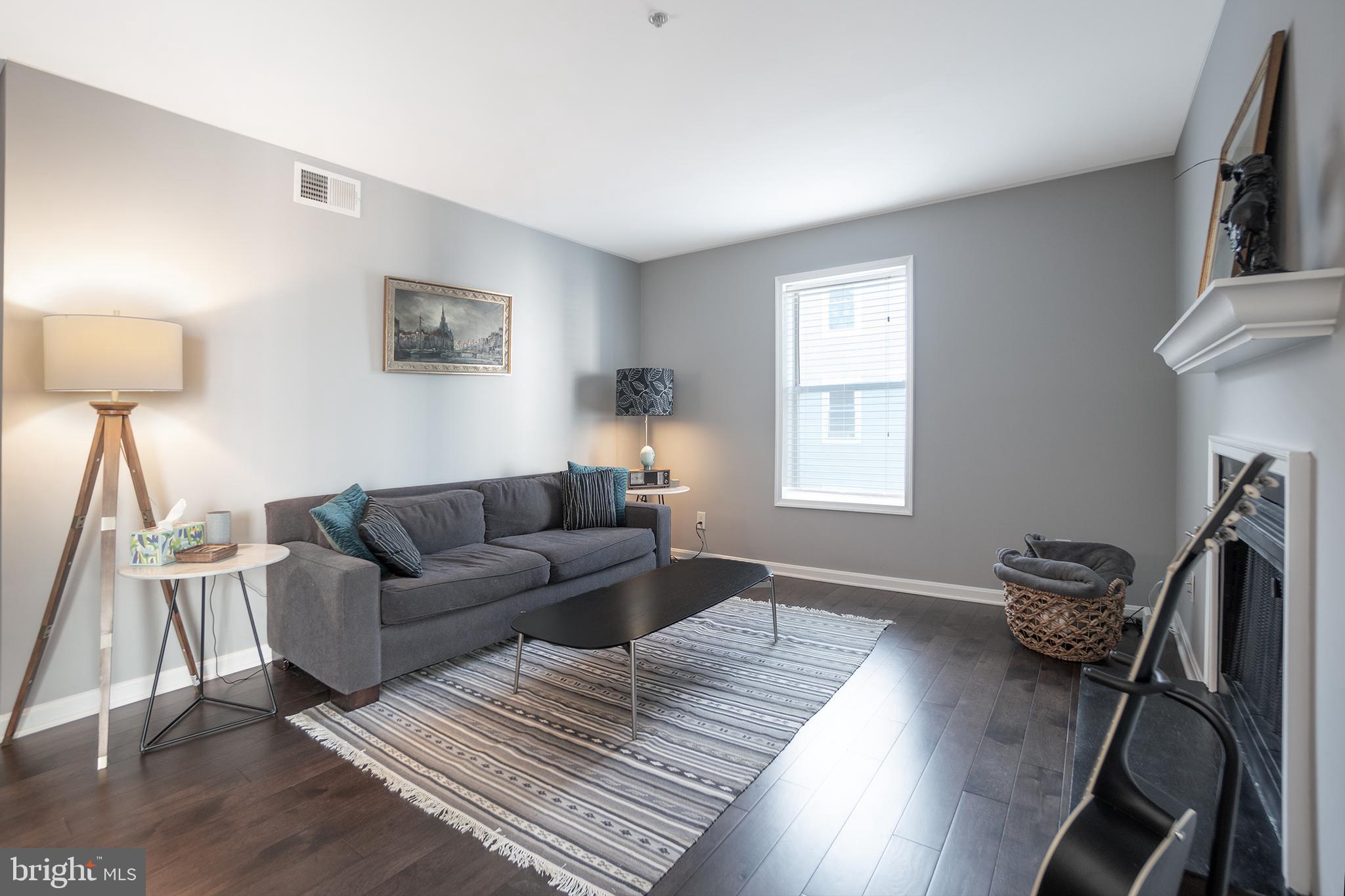 10248 Appalachian Circle, Unit 1D7 Oakton, VA 22124 - Photo 15 of 32 a living room with furniture a desk and chair with wooden floor