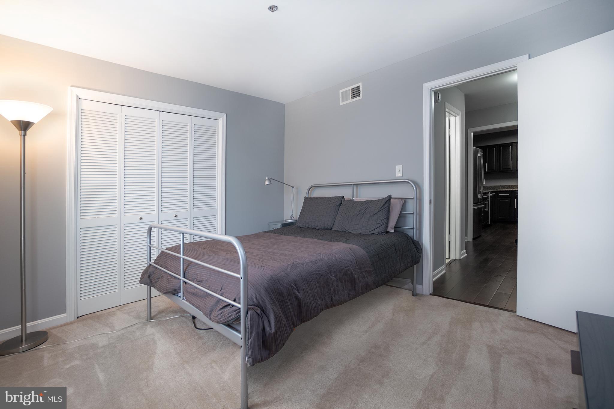 10248 Appalachian Circle, Unit 1D7 Oakton, VA 22124 - Photo 18 of 32 a bedroom with a bed and window