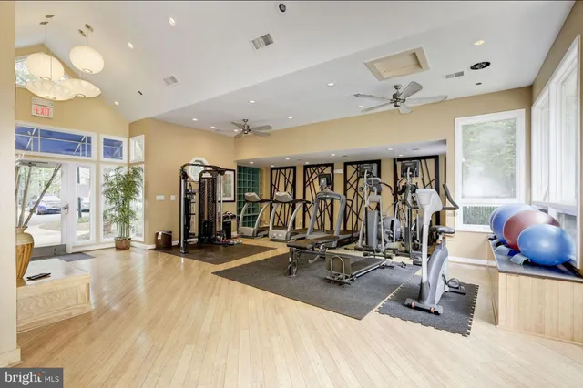 a view of a swimming pool with chairs in patio