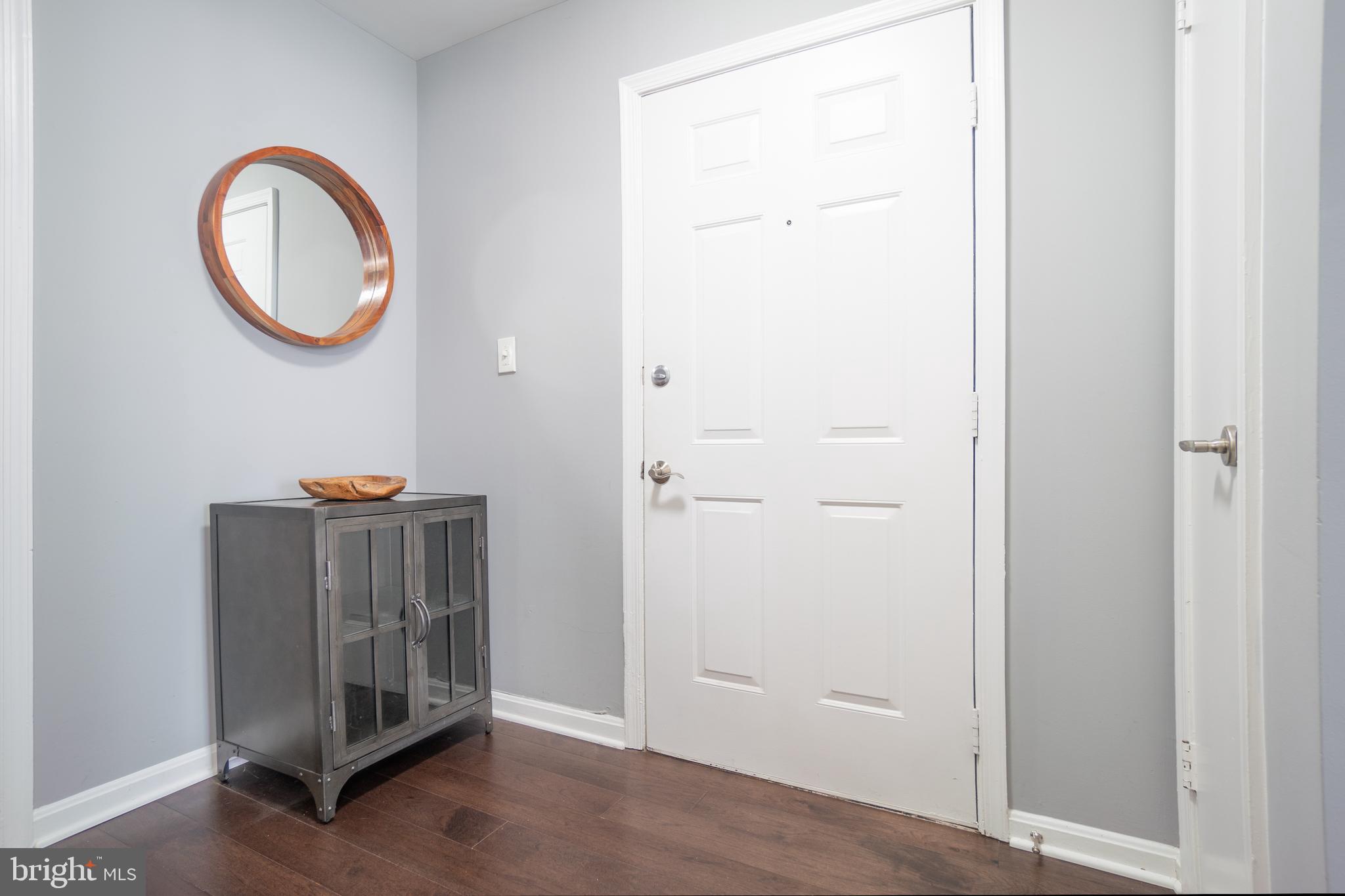 10248 Appalachian Circle, Unit 1D7 Oakton, VA 22124 - Photo 3 of 32 a view of a room with wooden floor and a sink
