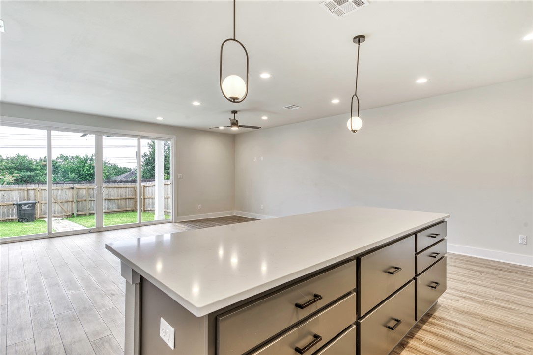 301 Cooner Street, Unit A College Station, TX 77840 - Photo 11 of 36 an empty room with wooden floor