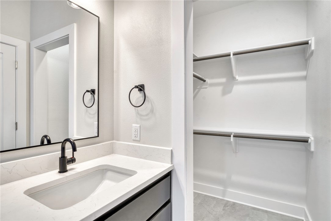 301 Cooner Street, Unit A College Station, TX 77840 - Photo 18 of 36 a bathroom with a sink and a large mirror