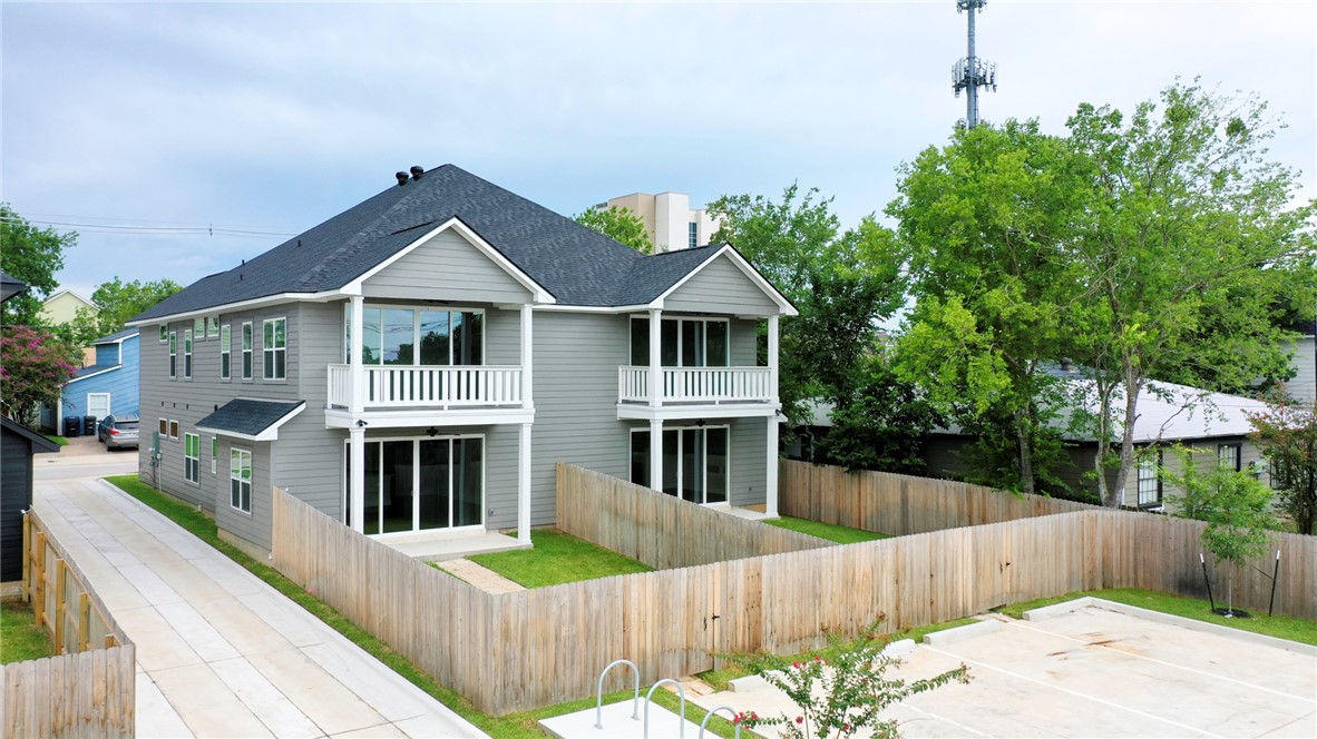 301 Cooner Street, Unit A College Station, TX 77840 - Photo 2 of 36 a front view of a house with wooden fence