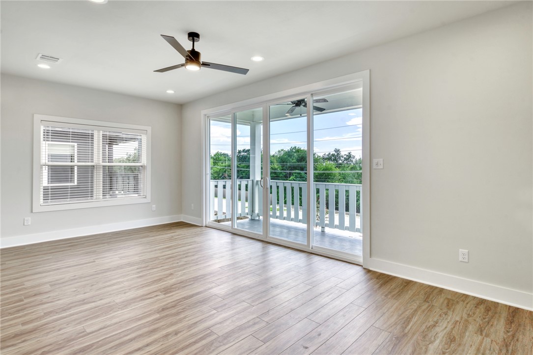 301 Cooner Street, Unit A College Station, TX 77840 - Photo 27 of 36 a view of an empty room with wooden floor and a window