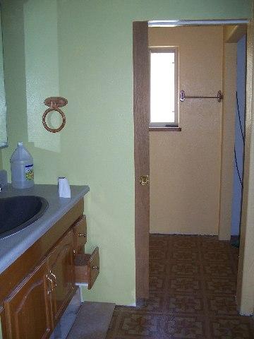 165 Cindys Way Rifle, CO 81650 - Photo 3 of 4 a bathroom with a sink and a mirror