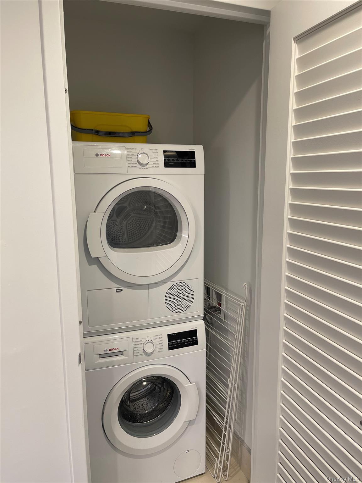 131-05 40 Road, Unit PH1D Queens, NY 11354 - Photo 11 of 23 Laundry area with stacked washer / drying machine