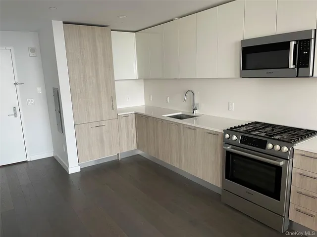 a kitchen with a stove and a microwave