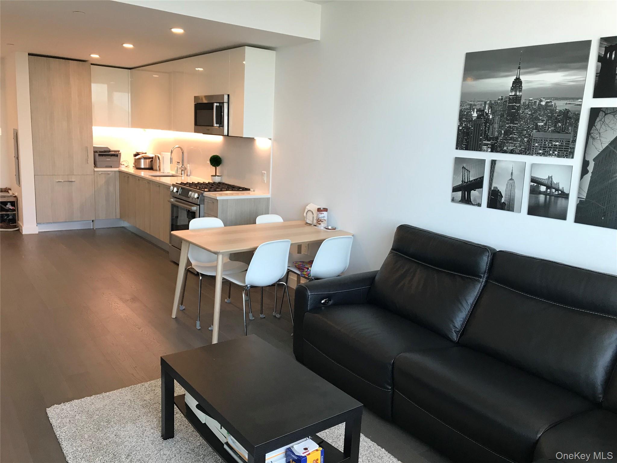 131-05 40 Road, Unit PH1D Queens, NY 11354 - Photo 6 of 23 Living room featuring dark wood finished floors and recessed lighting