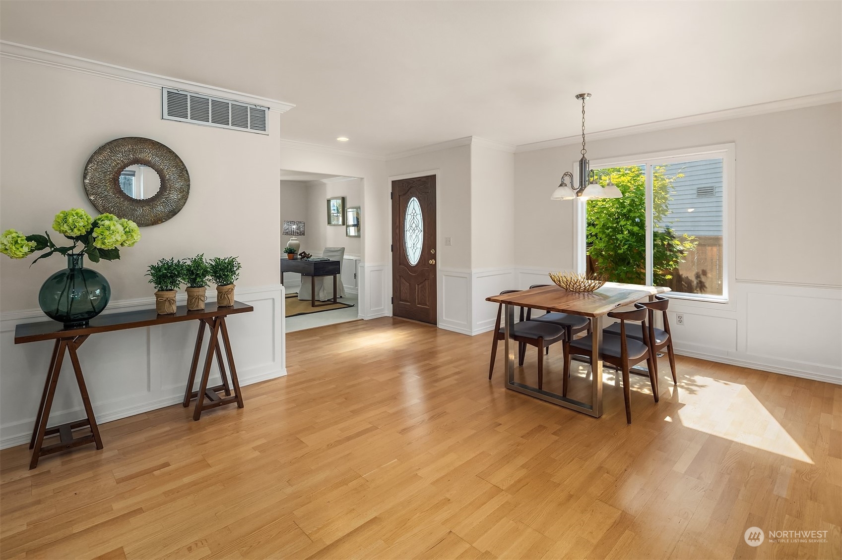 9222 Northeast 173rd Place Bothell, WA 98011 - Photo 14 of 37 a view of a dining room with furniture window and wooden floor