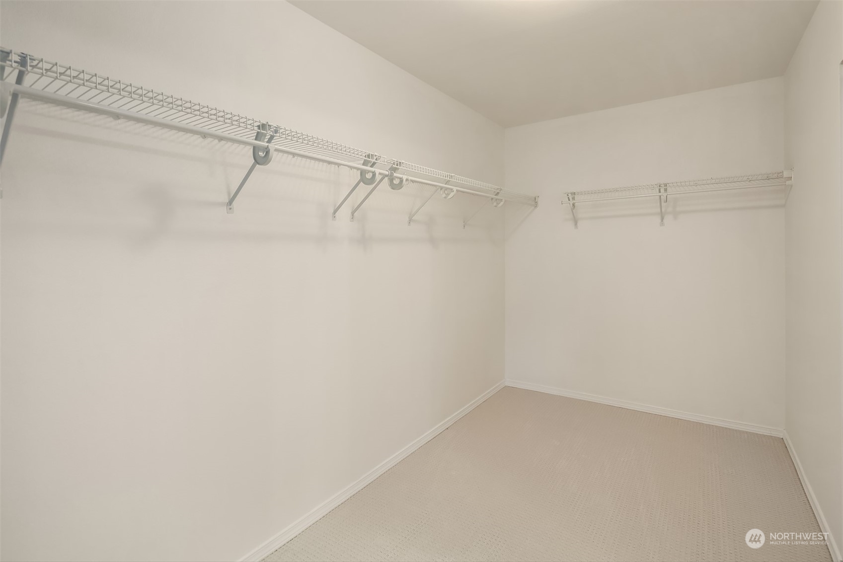 9222 Northeast 173rd Place Bothell, WA 98011 - Photo 19 of 37 a view of a room with racks on the wall