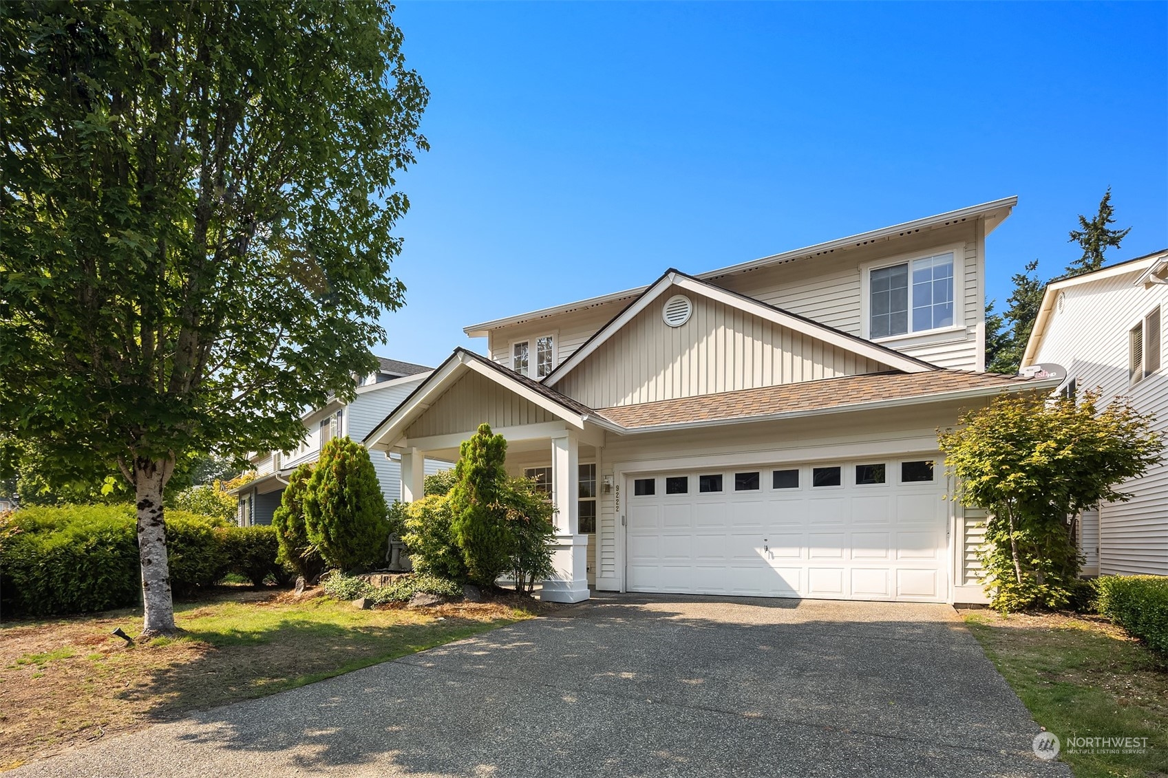 9222 Northeast 173rd Place Bothell, WA 98011 - Photo 32 of 37 a front view of a house with a yard and garage