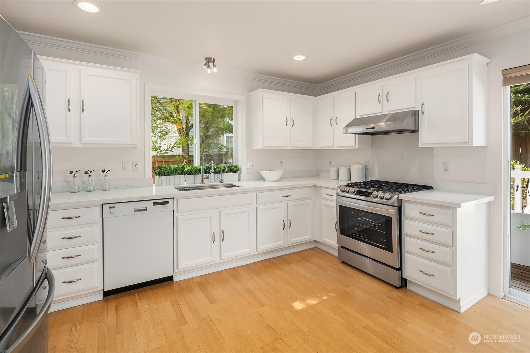 9222 Northeast 173rd Place Bothell, WA 98011 - Photo 5 of 37 a kitchen with cabinets appliances and a window