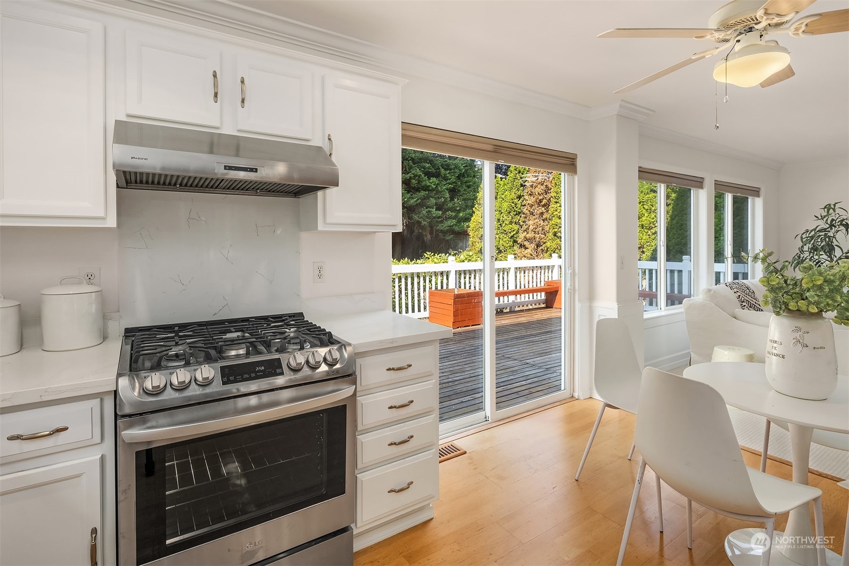 9222 Northeast 173rd Place Bothell, WA 98011 - Photo 7 of 37 a kitchen with granite countertop a stove and a wooden cabinets