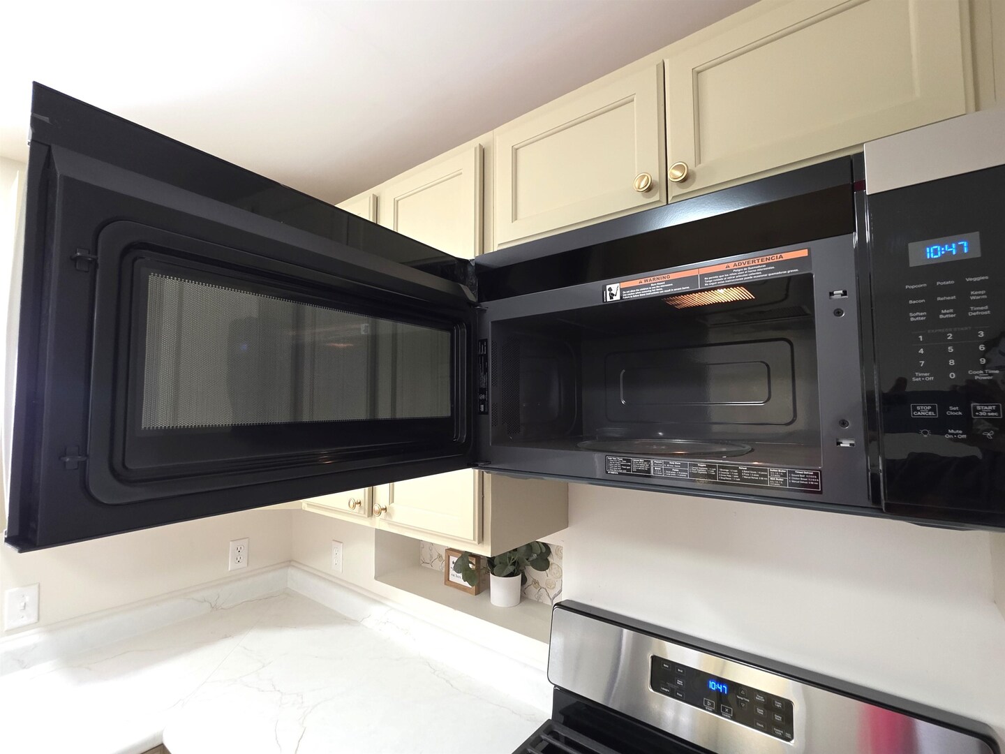 312 Lincoln Avenue Flora, IL 62839 - Photo 29 of 80 a kitchen with granite countertop a stove microwave and sink