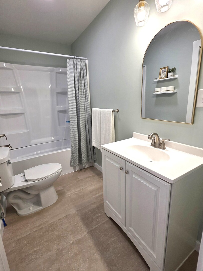 312 Lincoln Avenue Flora, IL 62839 - Photo 7 of 80 a bathroom with a sink a toilet and a large mirror