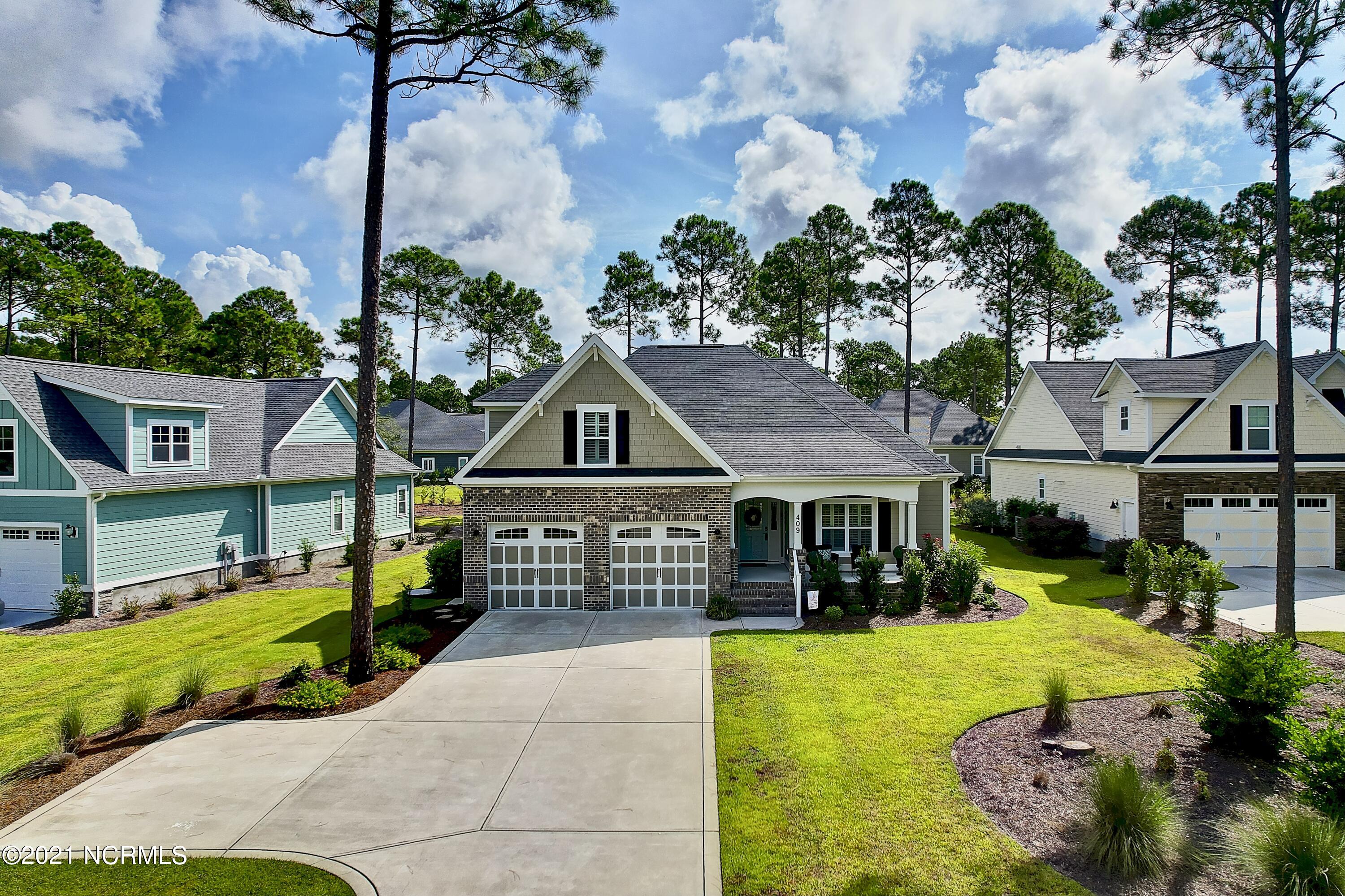 409 Planter's Ridge Drive Sunset Beach, NC 28468 - Photo 1 of 35 FRONT