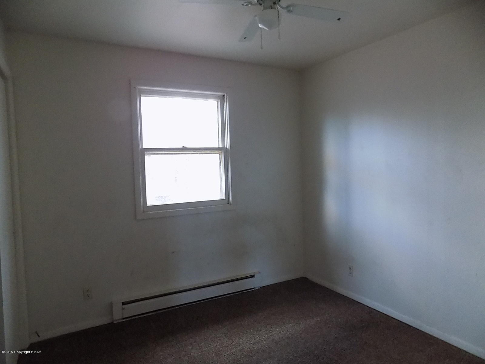856 Gold Finch Road Bushkill, PA 18324 - Photo 5 of 10 an empty room with a window