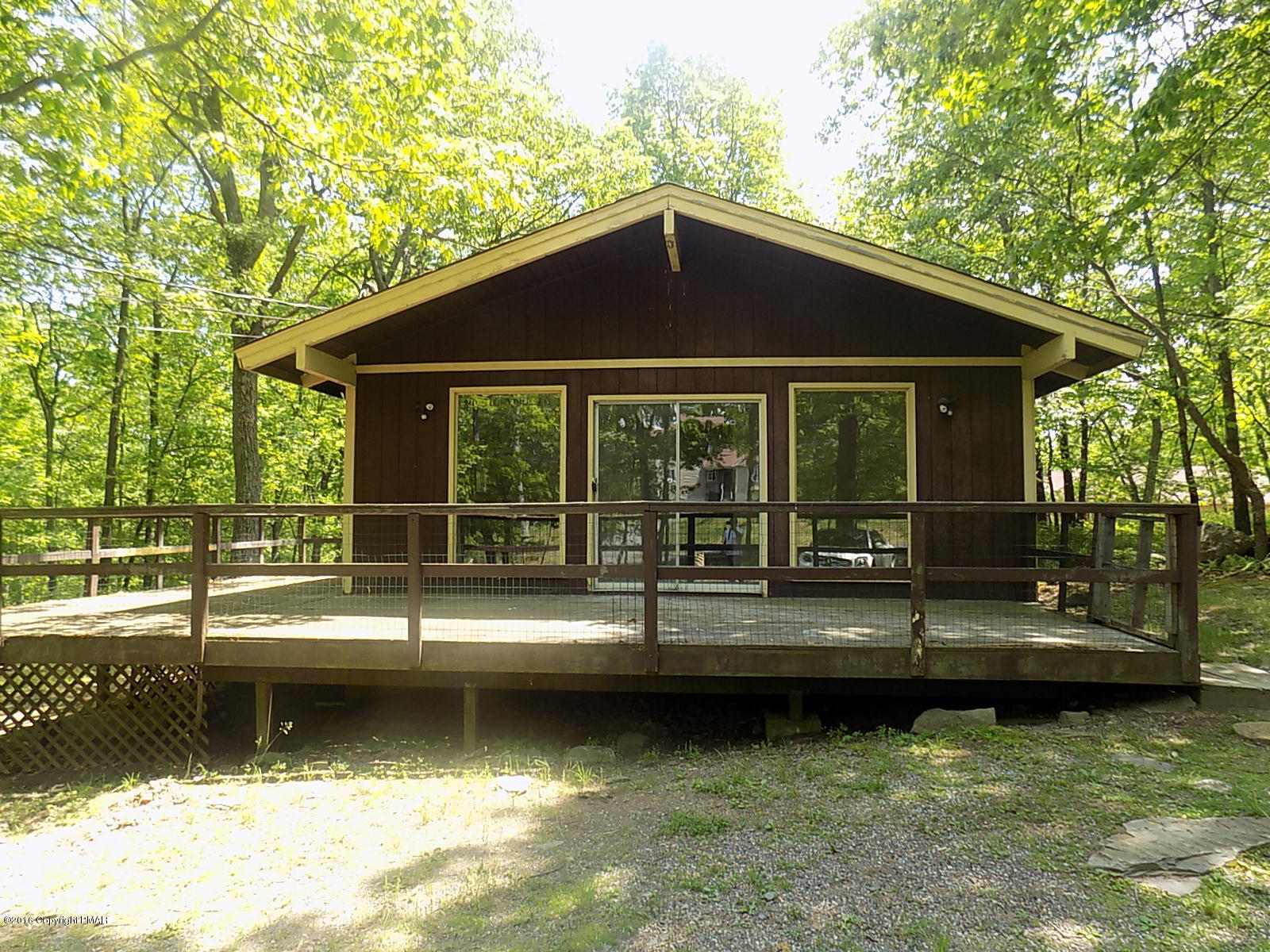 856 Gold Finch Road Bushkill, PA 18324 - Photo 8 of 10 a view of a house with swimming pool next to a yard