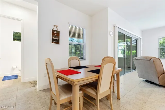 a view of a dining room with furniture window and outside view