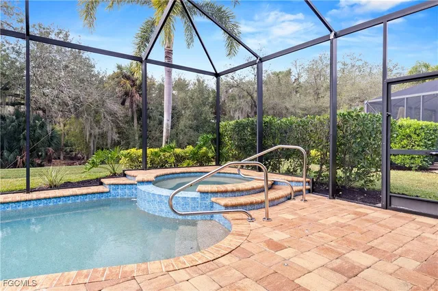 a view of a swimming pool with a lounge chair