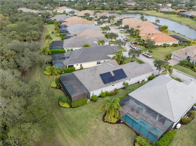 an aerial view of a house with a lake view