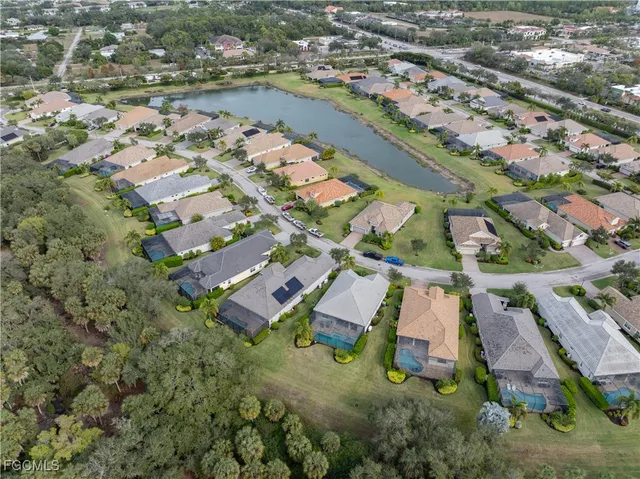 an aerial view of residential building and lake