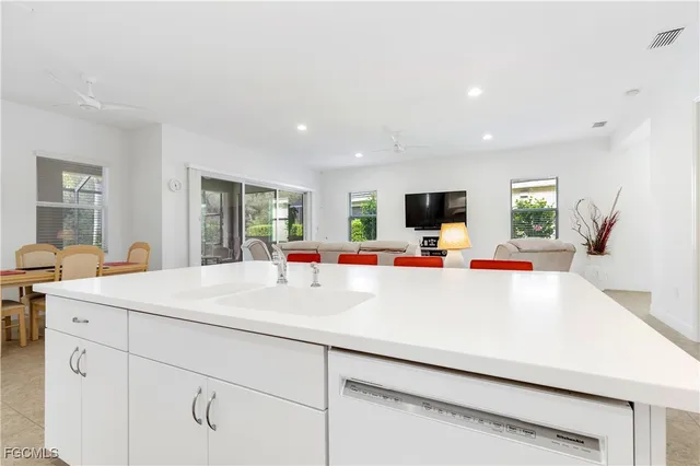 a view of kitchen with cabinets and wooden floor