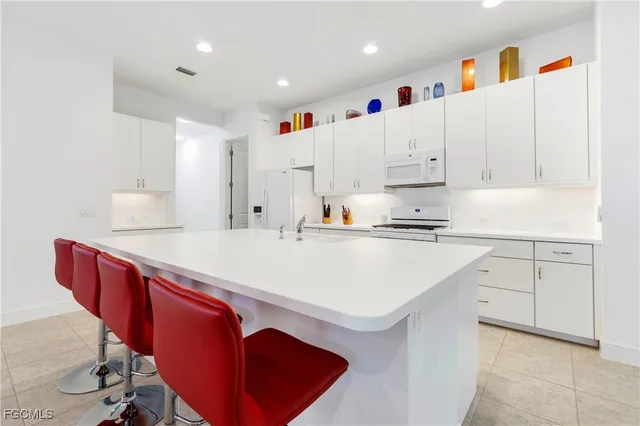 a kitchen with stainless steel appliances cabinets and a refrigerator