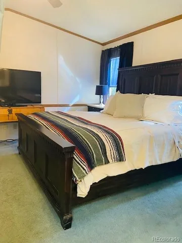a bedroom with a bed and lamp