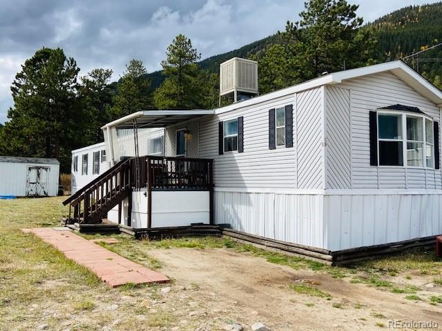 54 Windy Gap Loop Empire, CO 80438 - Photo 2 of 48 a view of a house with a yard with wooden fence