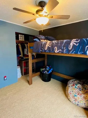 a white toilet sitting next to a bathroom sink and a shower