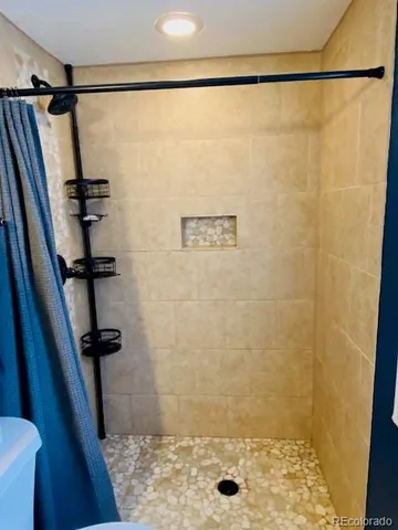 a bed sitting in a room next to a window