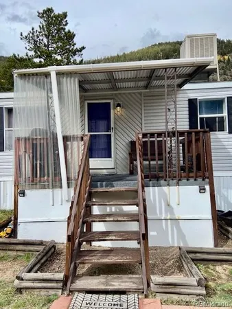 a front view of a house with stairs