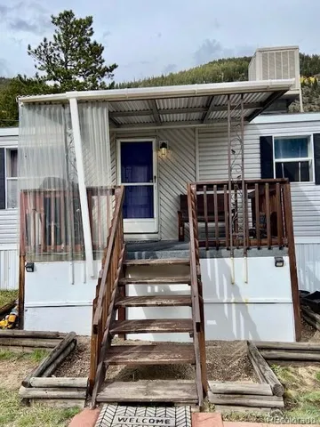 a front view of a house with stairs