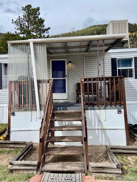 54 Windy Gap Loop Empire, CO 80438 - Photo 4 of 48 a front view of a house with stairs