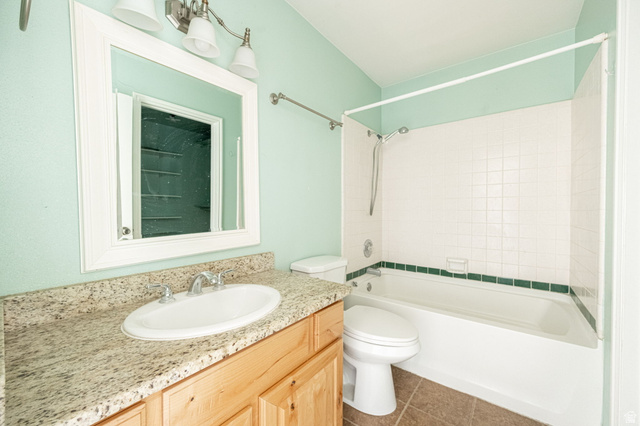 161 West 950 South, Unit C5 St. George, UT 84770 - Photo 13 of 14 Bathroom featuring a wood-finish vanity with a light granite countertop