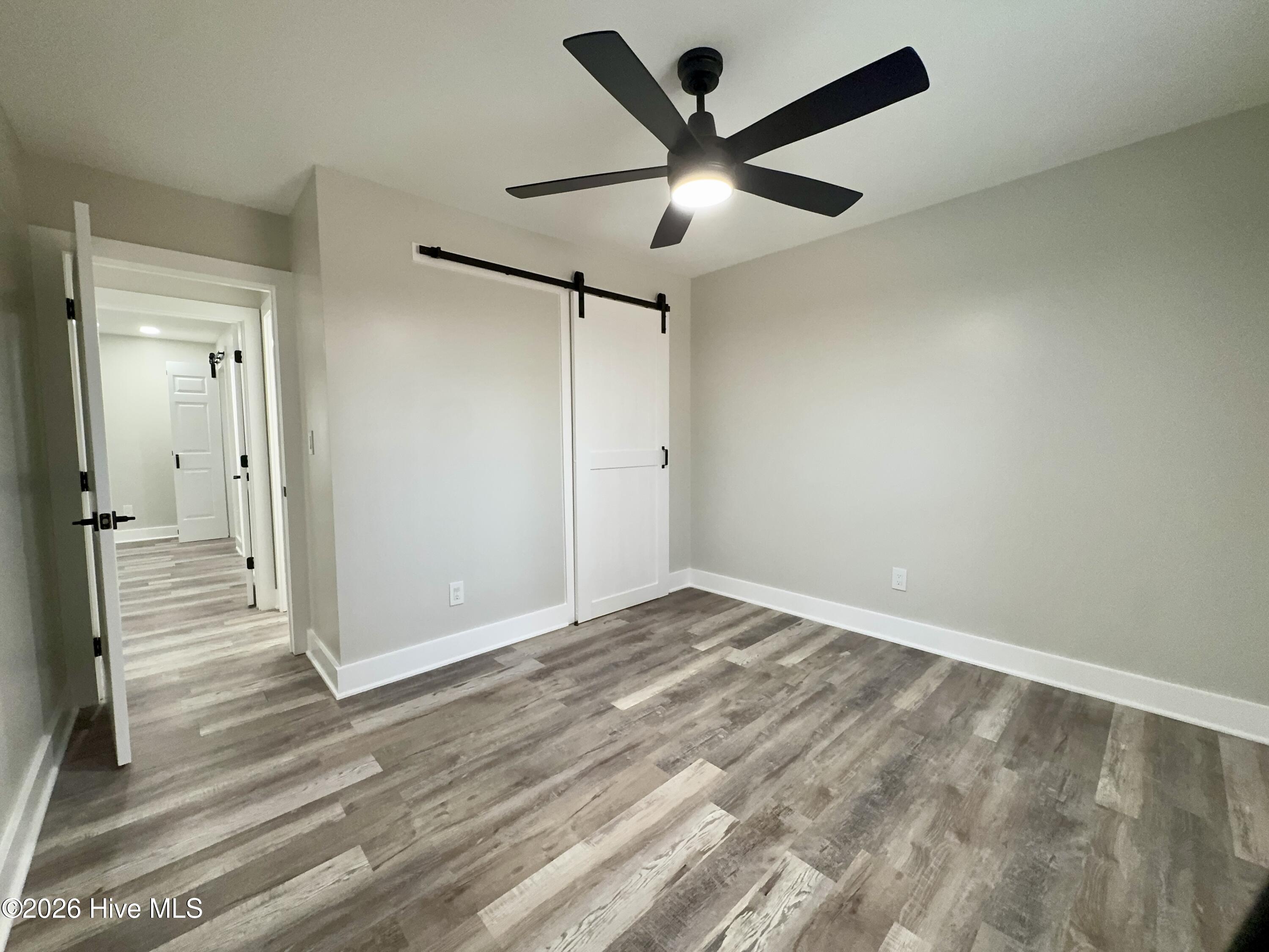 554 North Trotman Road Camden, NC 27921 - Photo 16 of 30 2nd bedroom with barn door closet