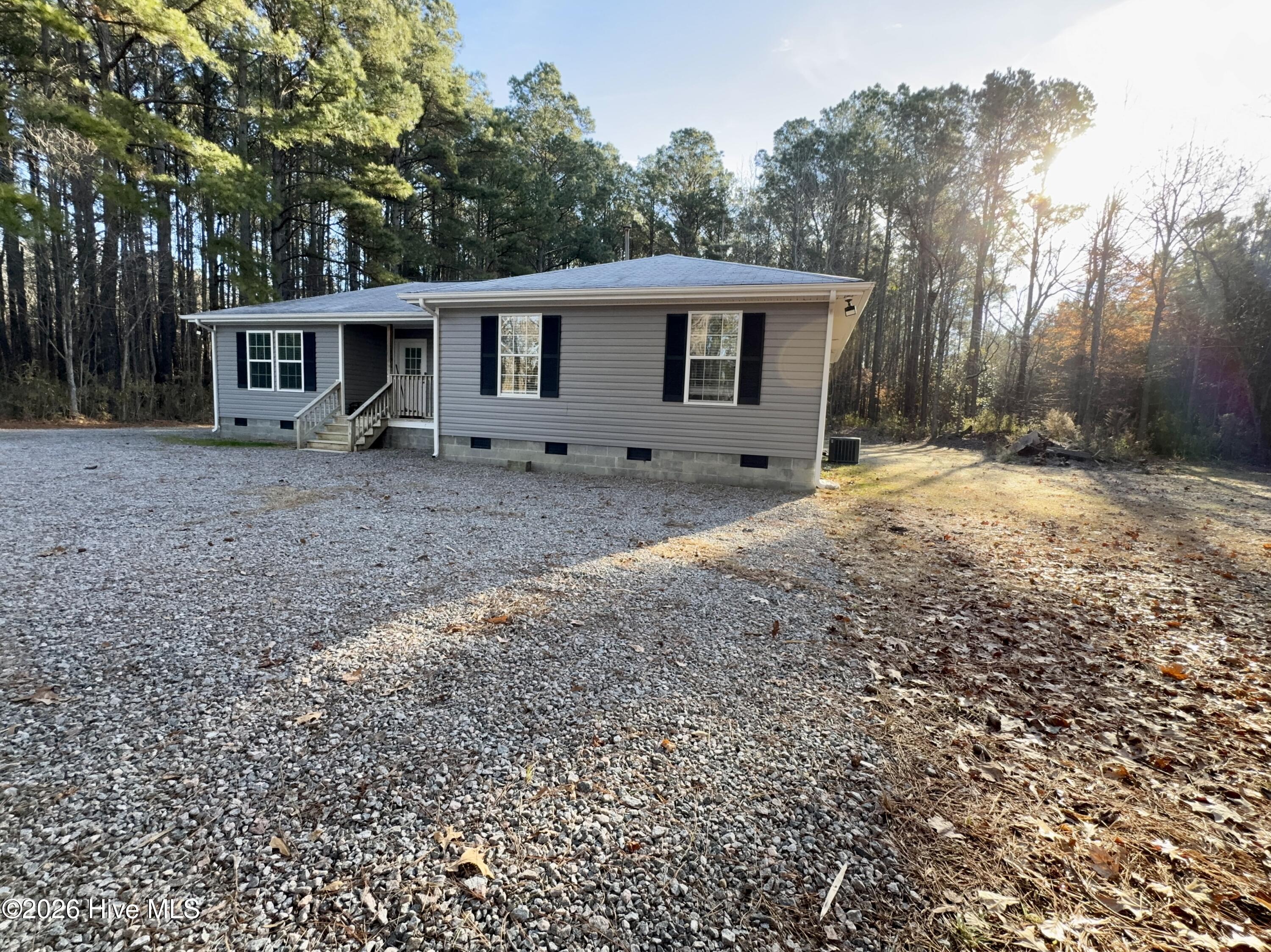 554 North Trotman Road Camden, NC 27921 - Photo 23 of 30 Front of home showing large cleared side yard for expansion.