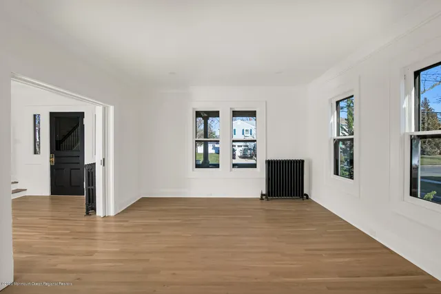 a view empty room with wooden floor and stairs
