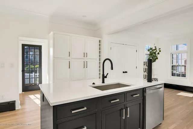a kitchen with a sink and cabinets