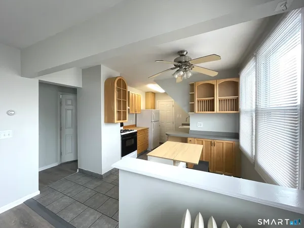 a kitchen with a refrigerator and a sink
