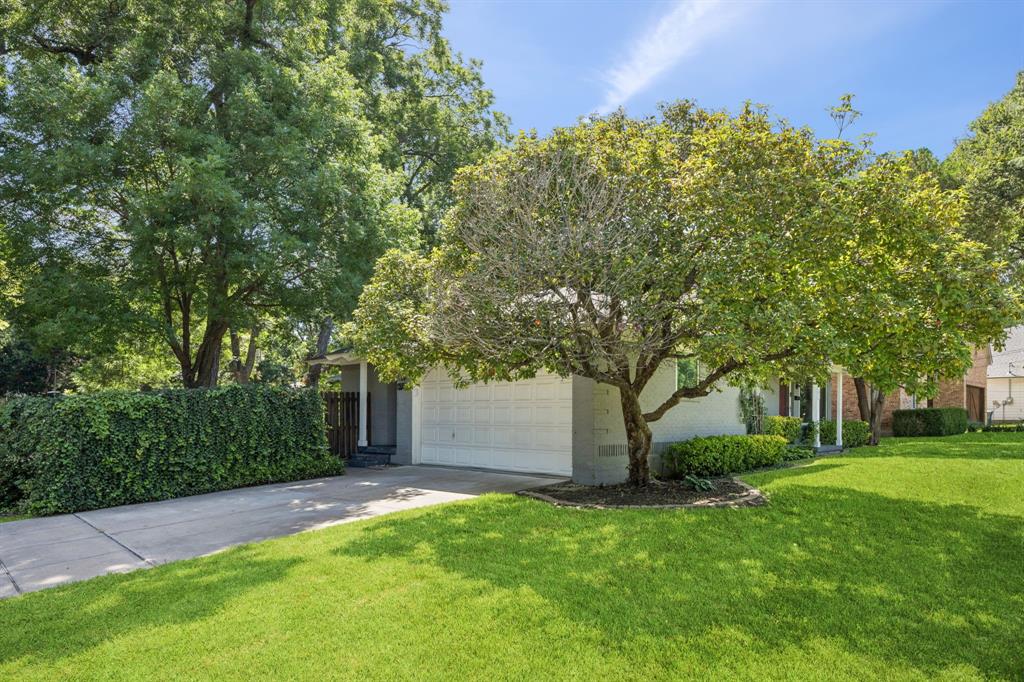 6742 Williamson Road Dallas, TX 75214 - Photo 2 of 11 Corner/Creek Lot With Side Entry 2-Car Garage, Mature Landscaping, Fenced Yard, and Covered Porches